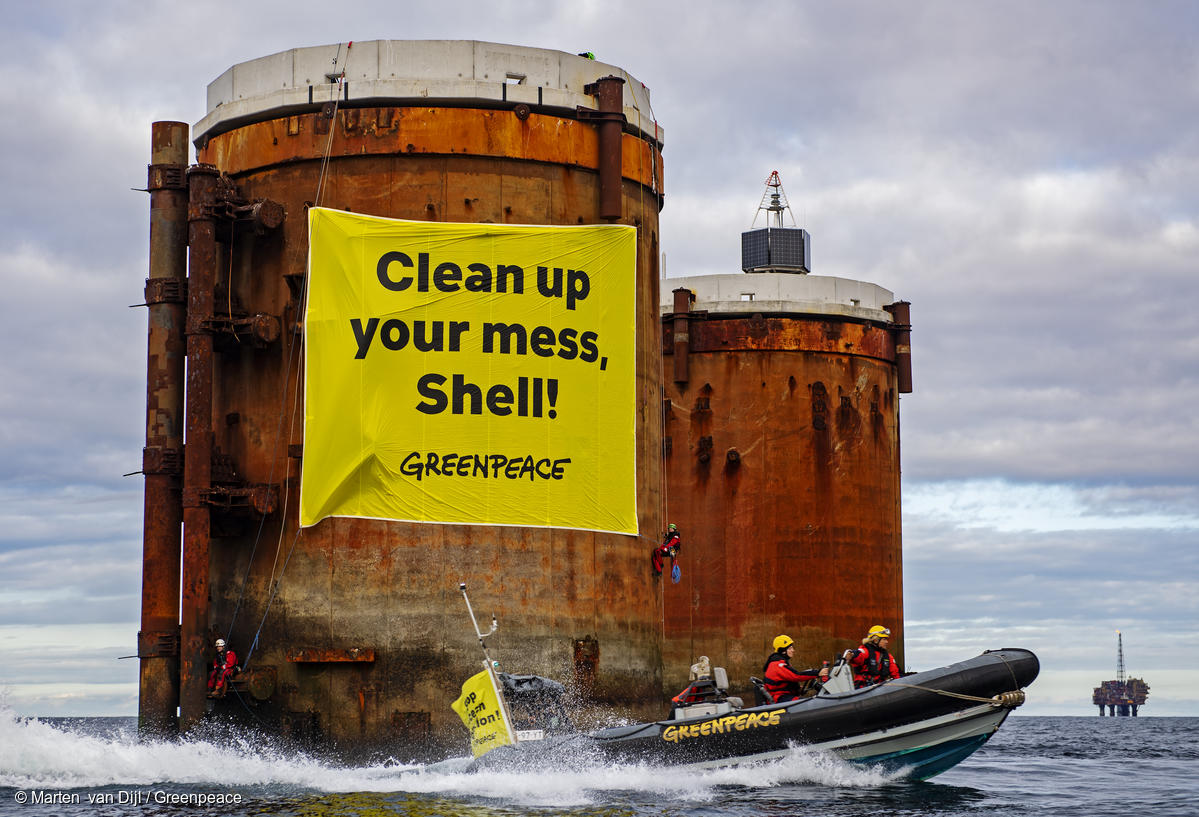 Greenpeace activists board Shell oil rigs in protest against plans to leave behind oil in the North Sea