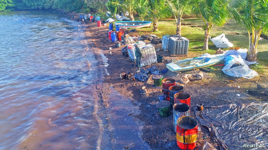 A drone image shows materials prepared by volunteers to handle leaked oil from the bulk carrier ship MV Wakashio, belonging to a Japanese company, which ran aground on a reef, at the Riviere des Creoles, Mauritius, Aug. 10, 2020.