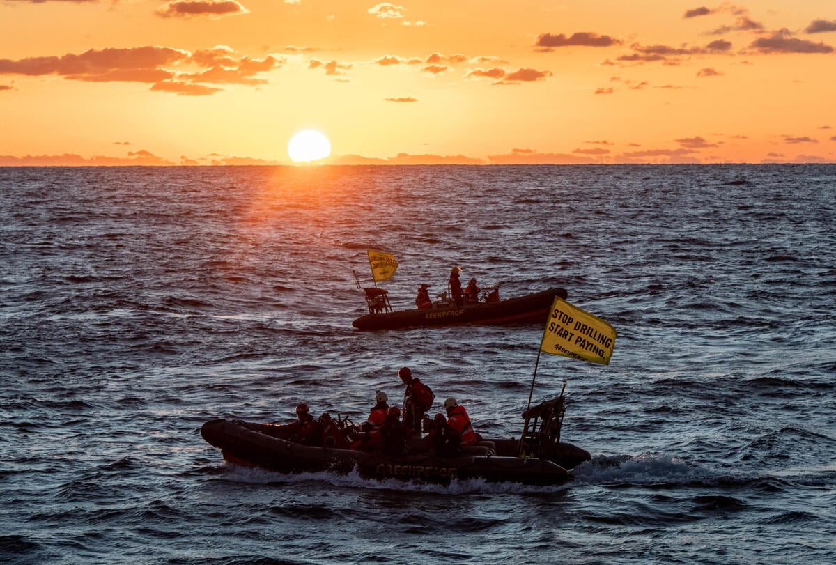 Greenpeace climate justice activists board and occupy Shell platform en route to major oilfield with message: ‘STOP DRILLING. START PAYING.’